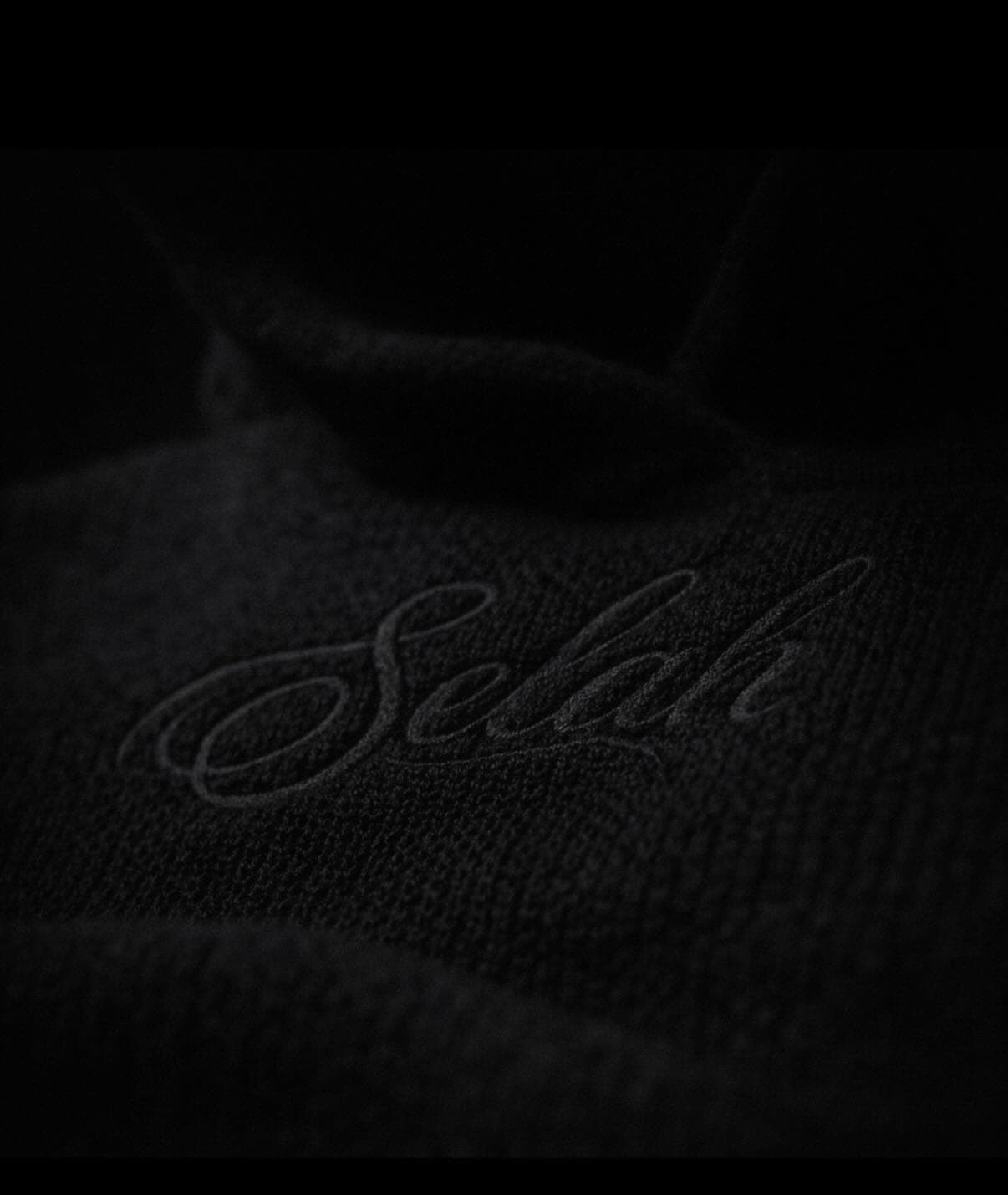 Macro of the tonal knit embroidery