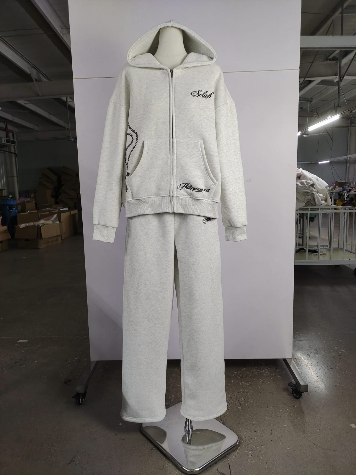 Rosary Zip Hoodie set in washed bone on a tailor's form
